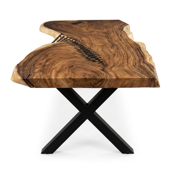 Side view of the suar wood tabletop showing its organic shape and natural contours.