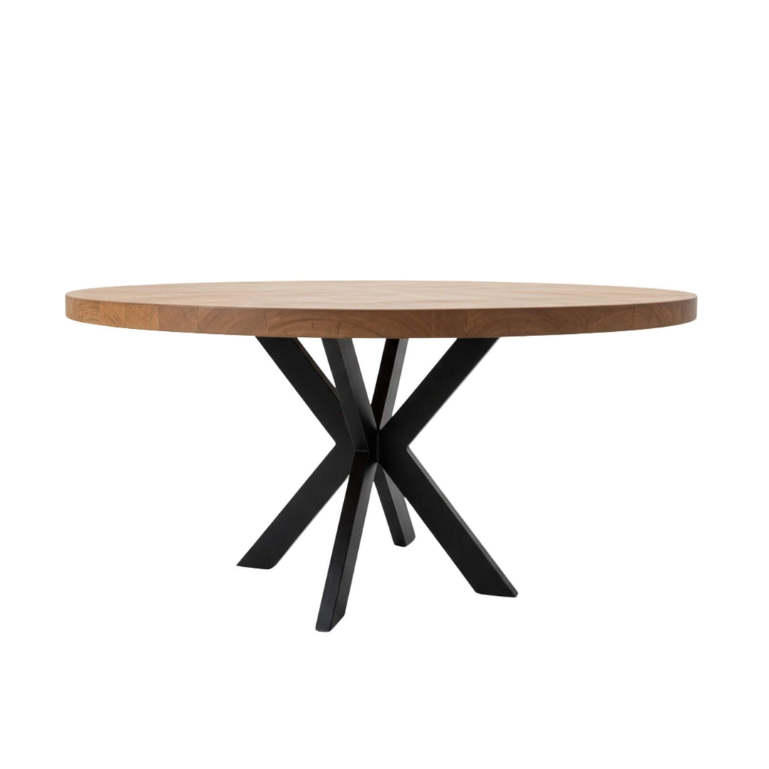 Side profile of the Gunung round dining table showing its sculptural silhouette.
