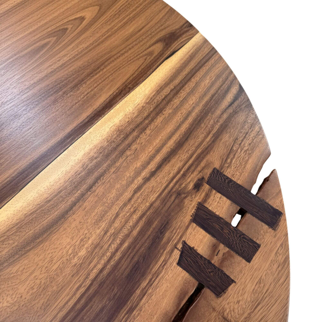 Detail of the handcrafted suar surface including natural markings.