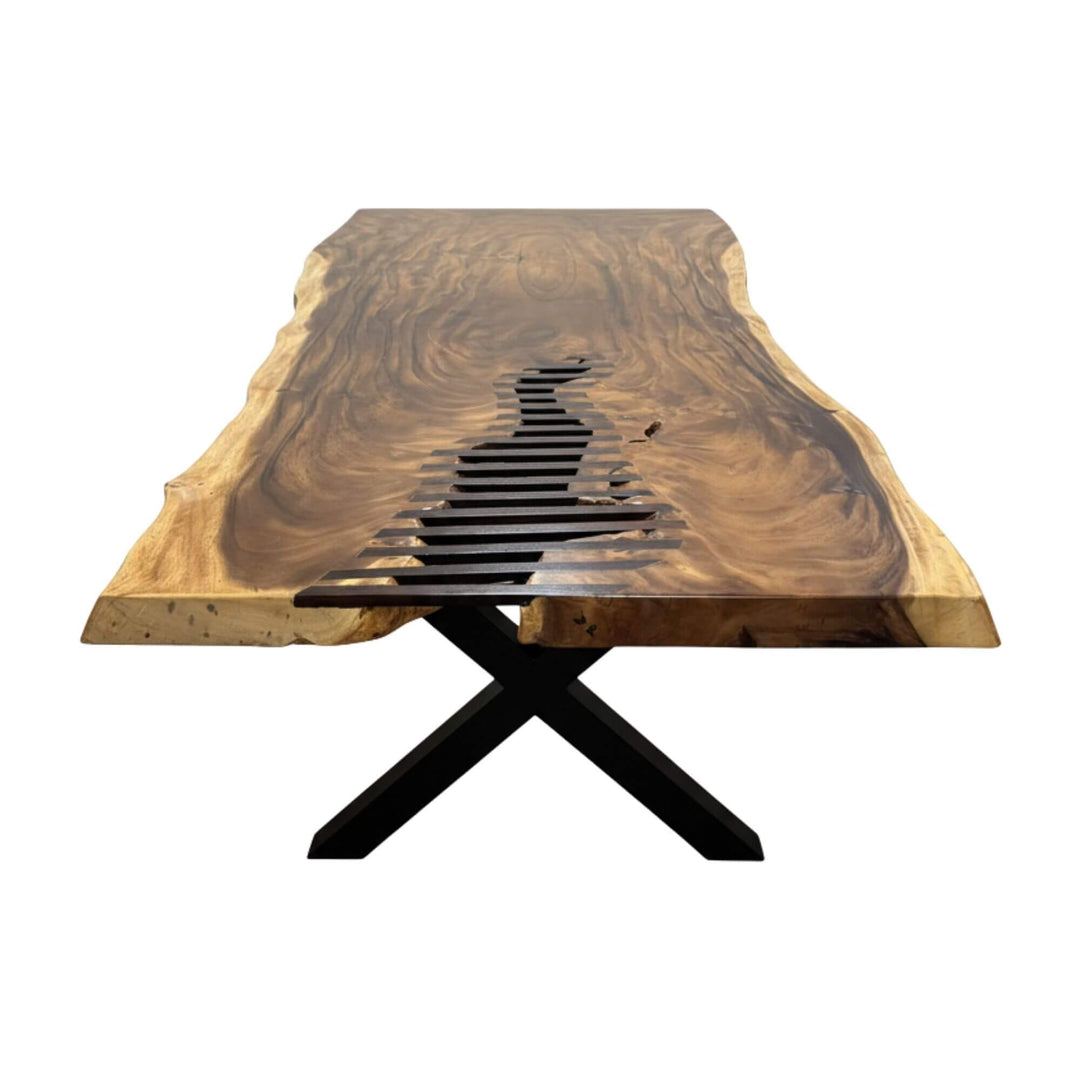 Front view of the Gunung Suar Dining Table showing its sculptural black metal base.