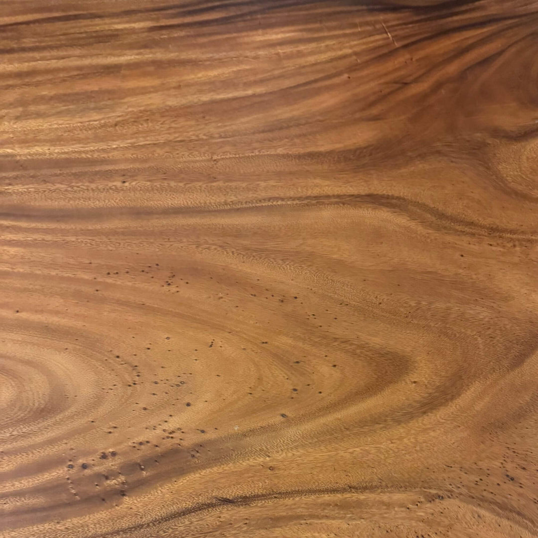 Close-up of natural suar wood grain detailing.