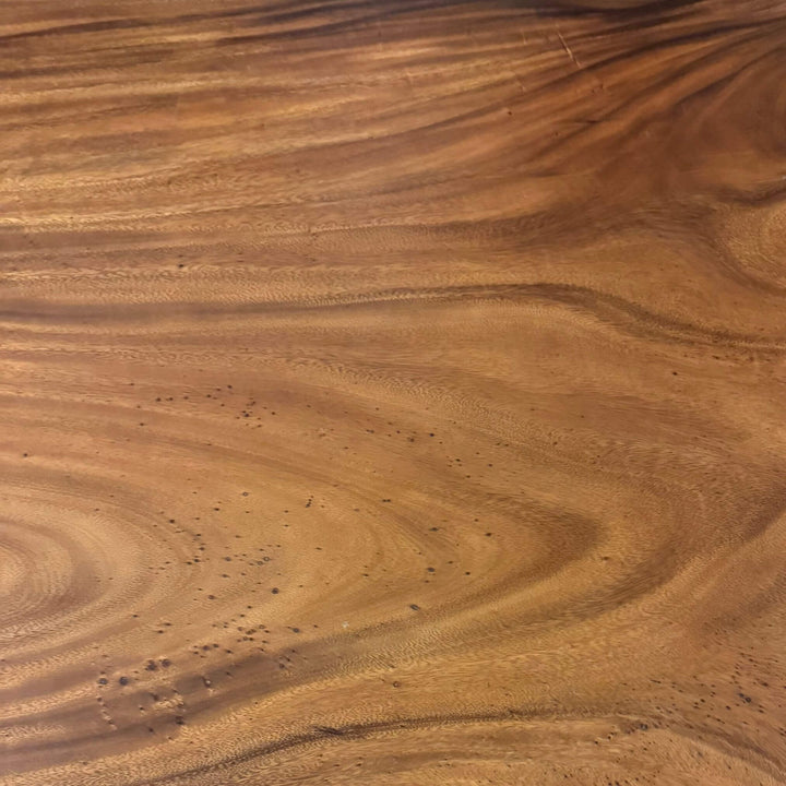 Close-up of natural suar wood grain detailing.
