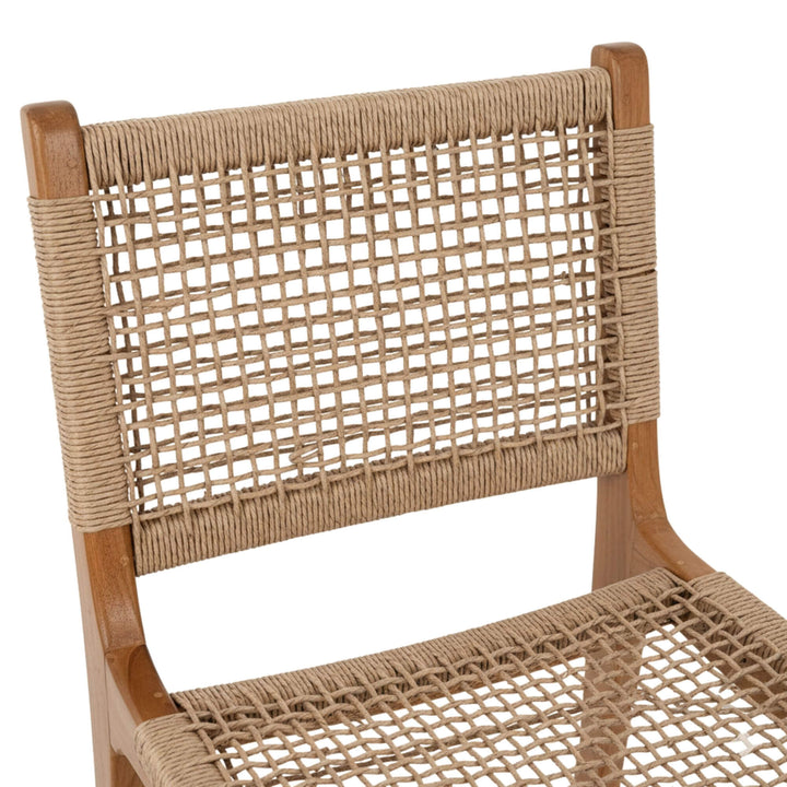 Close-up of the synthetic rattan texture on the stool’s backrest.
