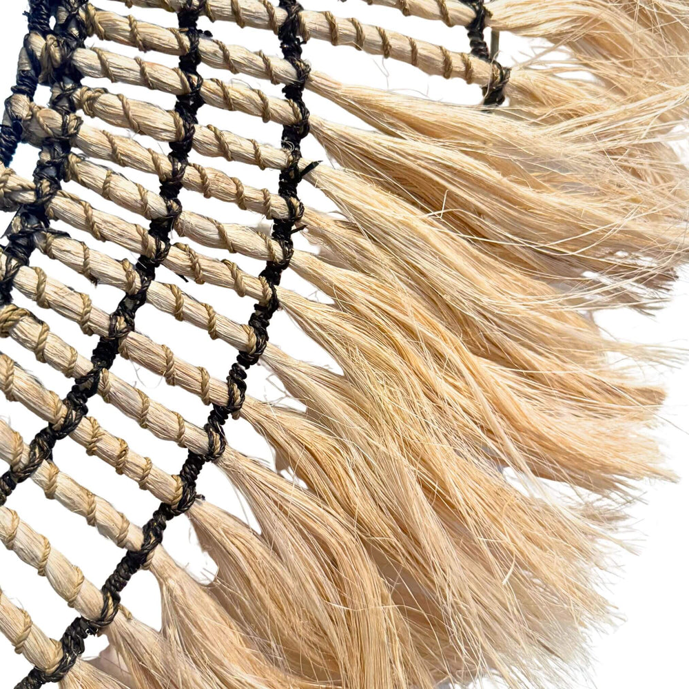 Close-up of Gora Mirror round design with natural sisal and rattan frame, handmade 80cm wall décor.