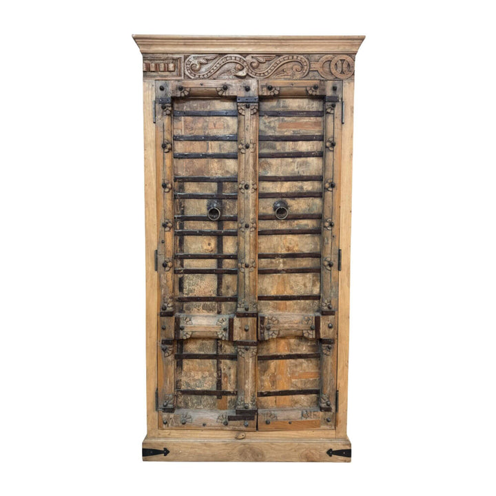 Front view of the Halfor wardrobe made from carved teak wood.