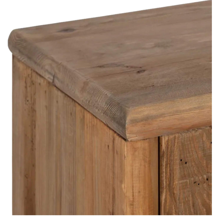 Top corner detail of wardrobe showing rounded wooden edge