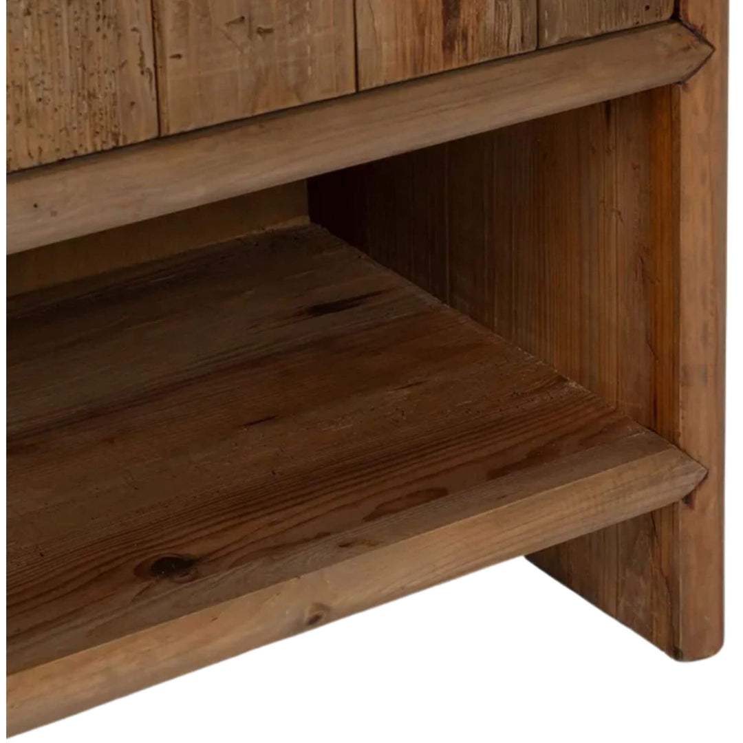 Close-up detail of lower wooden shelf inside the cabinet