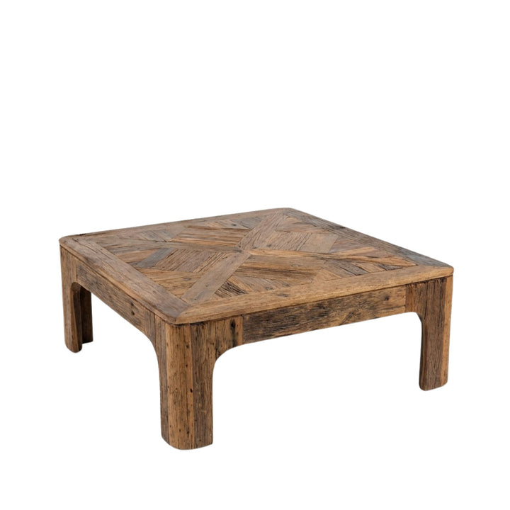 Angled view of Harat Coffee Table made from reclaimed wood with a solid, low-profile structure.
