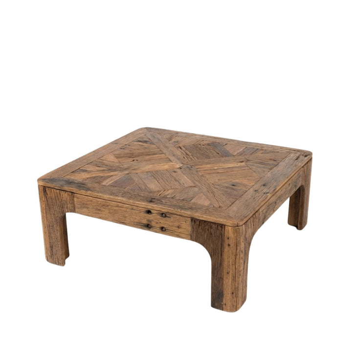Angled view of Harat Coffee Table made from reclaimed wood with a solid, low-profile structure.