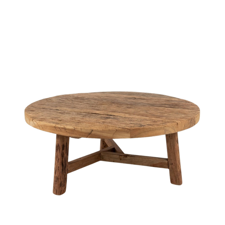 Front view of Harat Round Coffee Table made from reclaimed wood with a rustic round tabletop.