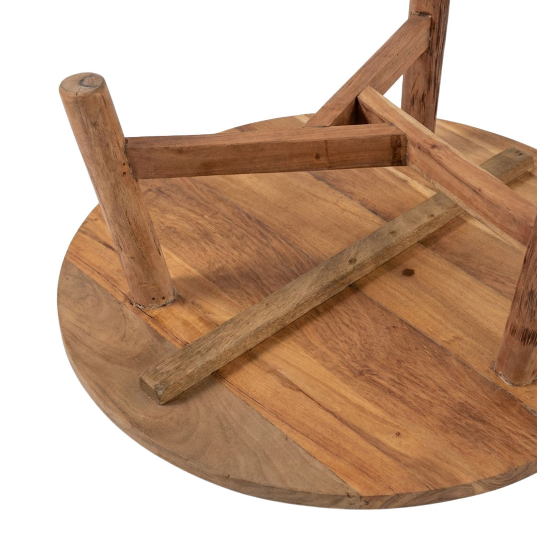 Detail view of Harat Round Coffee Table underside highlighting the solid wooden structure.