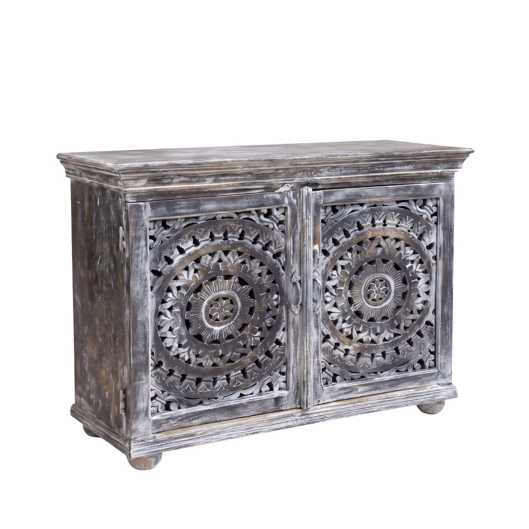 Front angled view of the Hardiwar buffet in mango wood with intricate circular carved doors and distressed dark finish