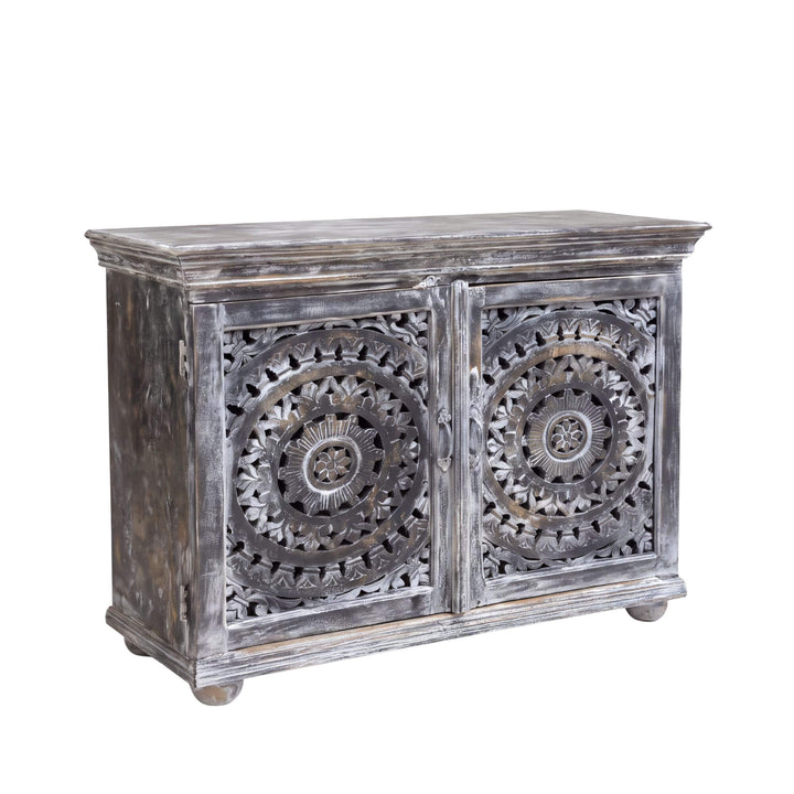 Front angled view of the Hardiwar buffet in mango wood with intricate circular carved doors and distressed dark finish
