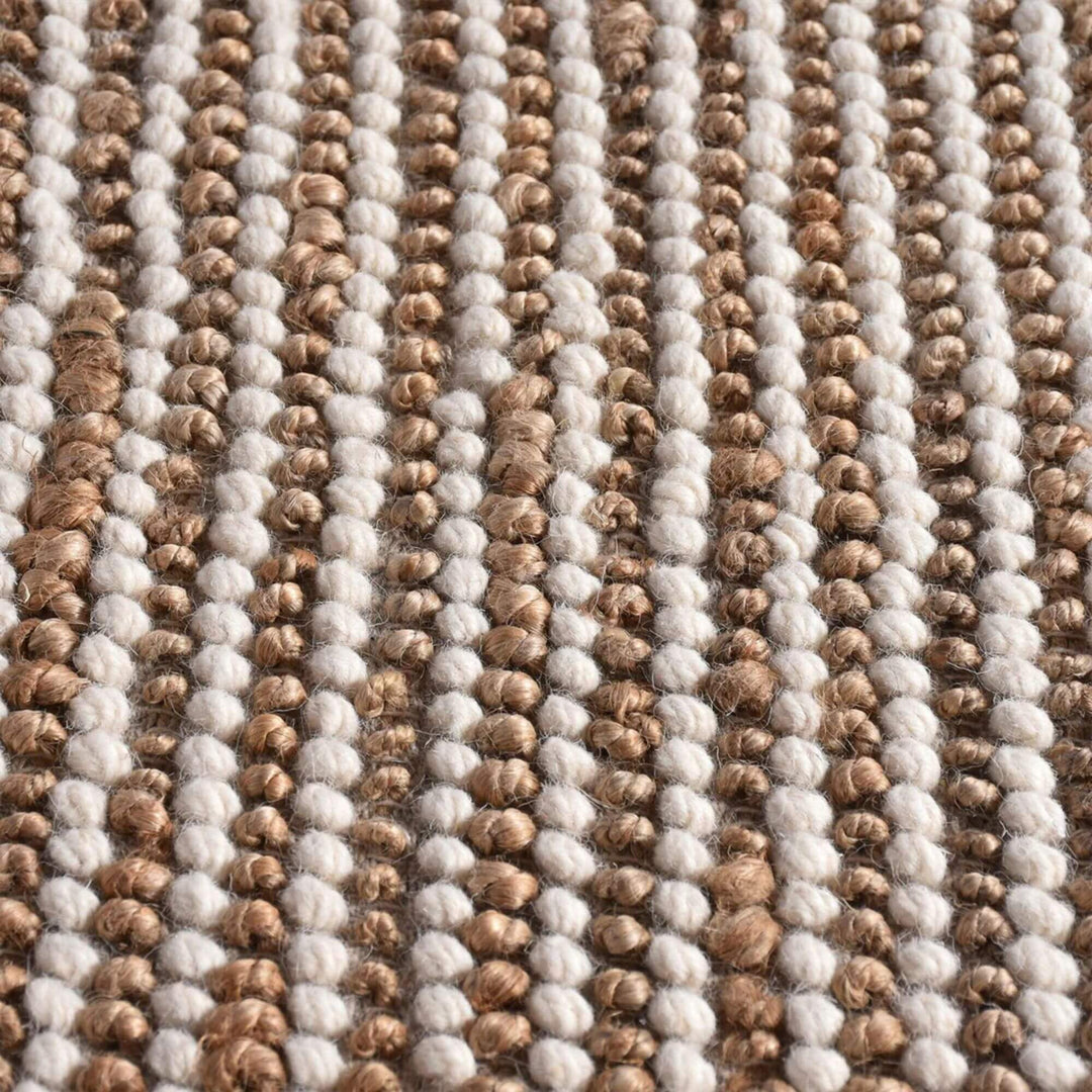 Close-up of the rug’s woven surface highlighting the blend of jute and wool fibers.