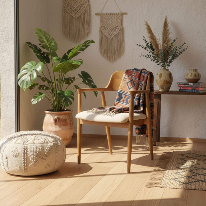 Haru Dining Chair displayed in a bright interior with natural teak frame and cream cushion.