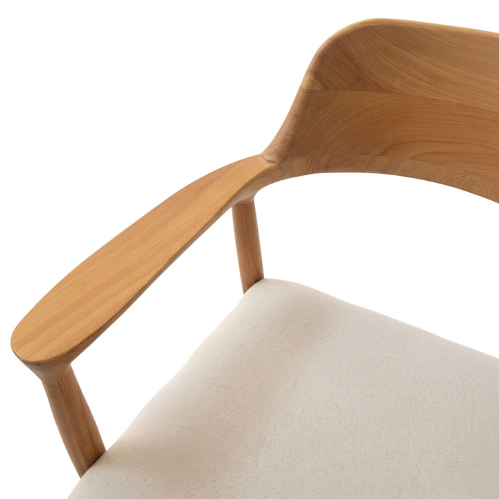 Close-up of the Haru Dining Chair’s curved backrest and upholstery texture.
