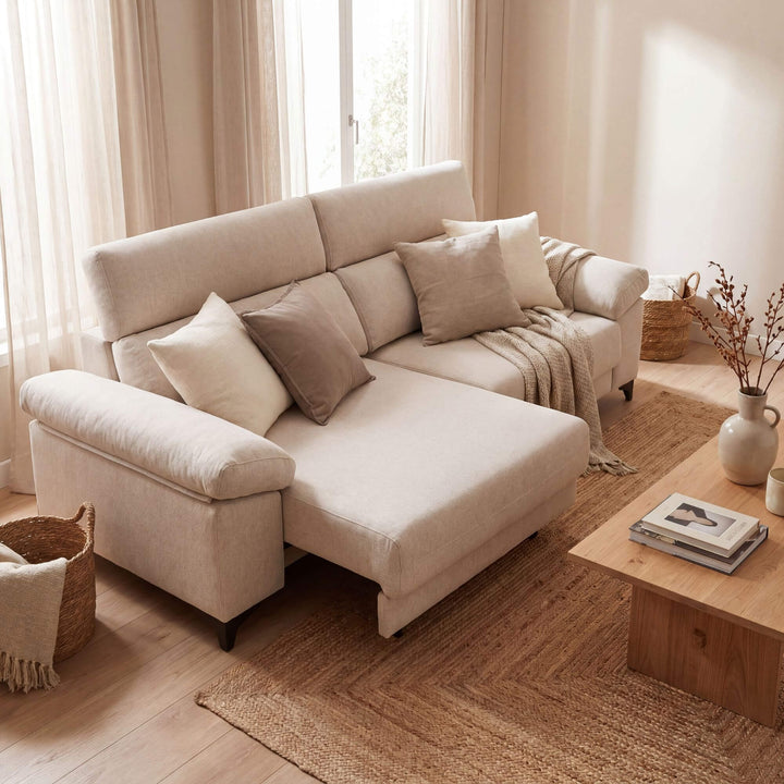 Styled living room setting featuring the Helsinki sofa with extended chaise section in a warm natural interior.
