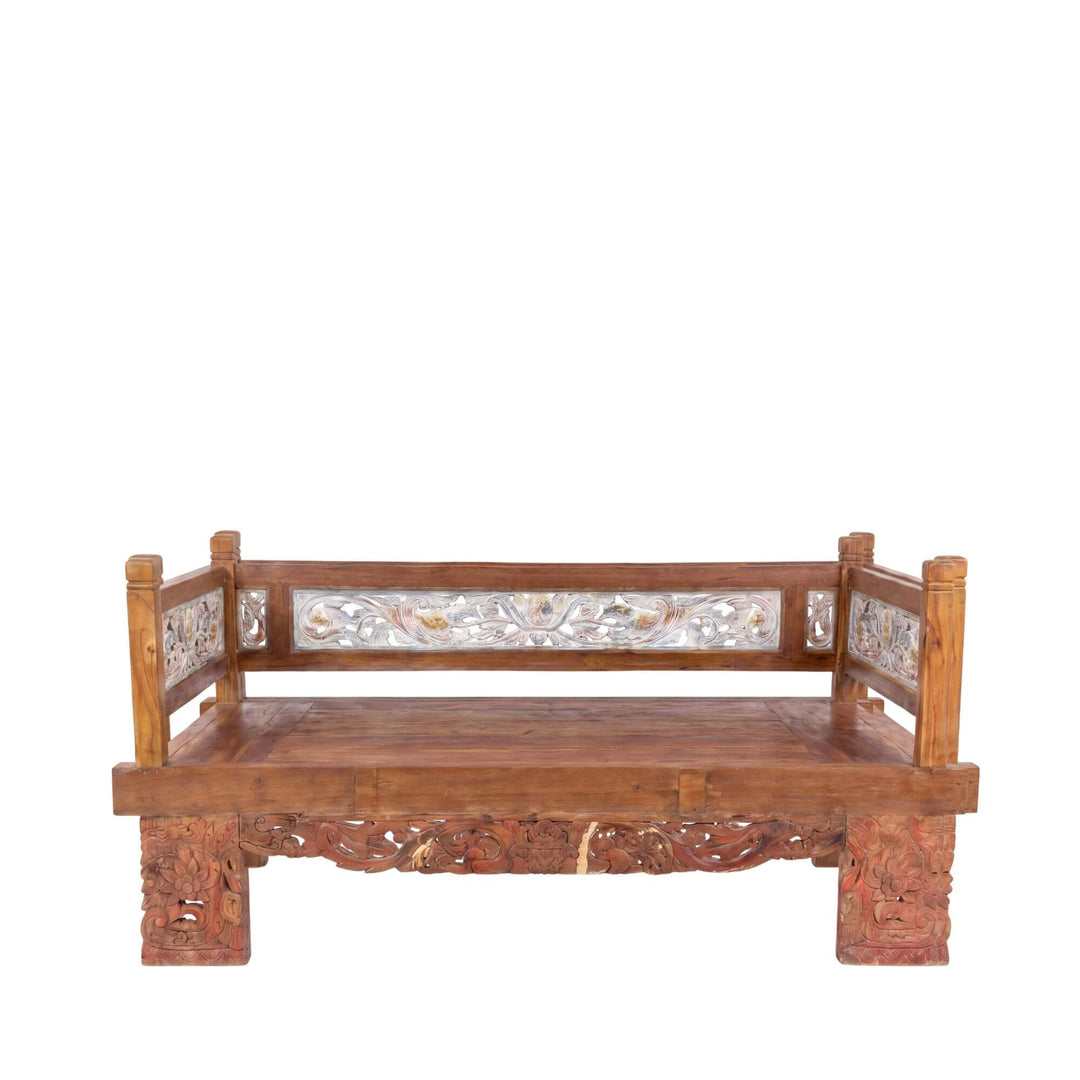 Front view of the daybed highlighting its carved apron, backrest panels, and solid reclaimed teak wood structure.
