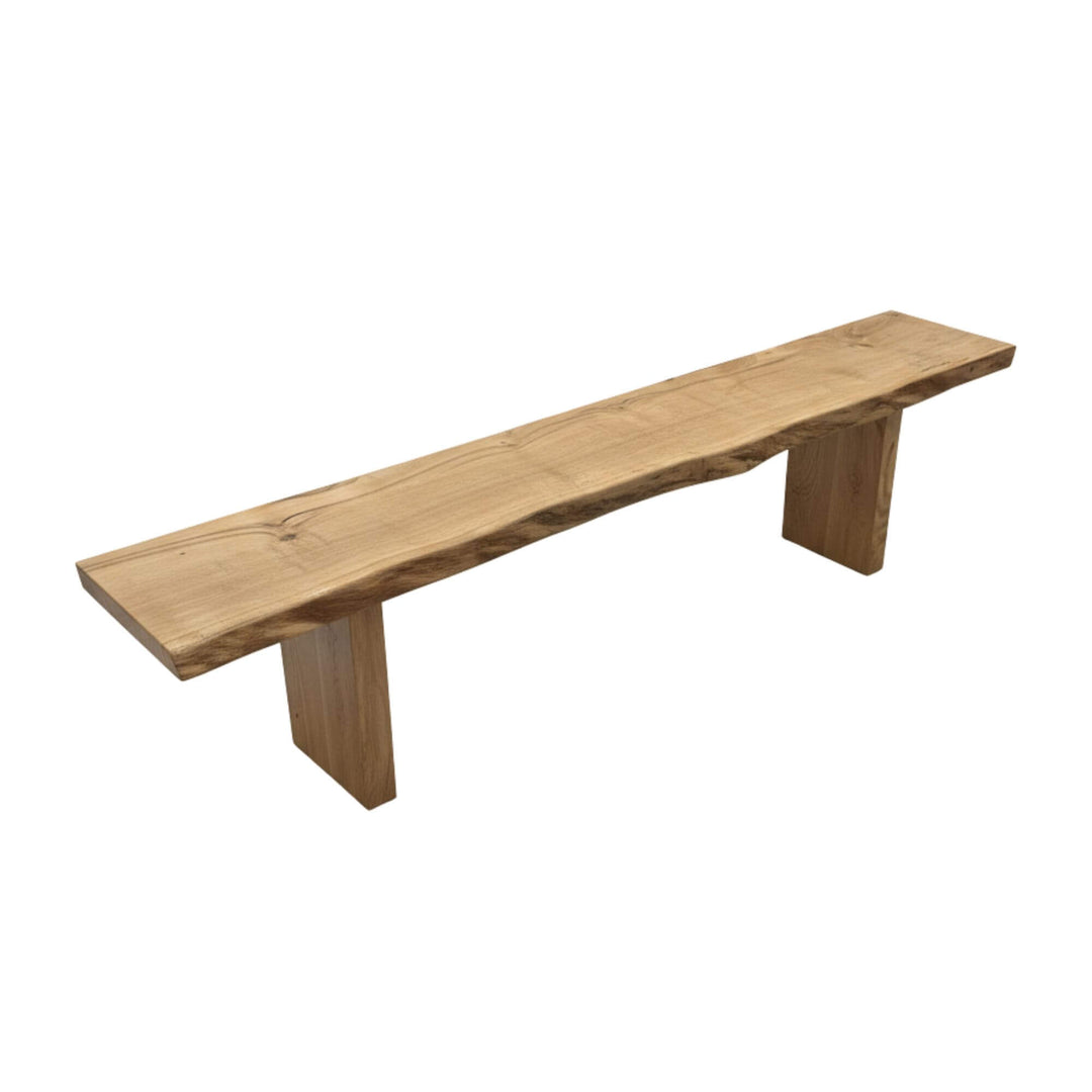 Full view of the Hera Bench showcasing its natural oak grain and minimalist shape.