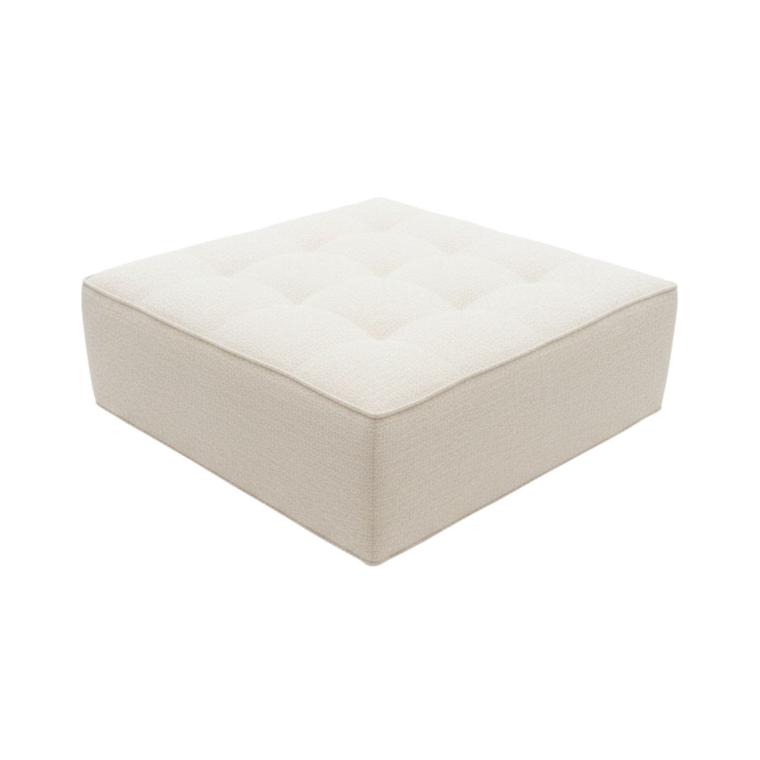 Angled view of a Hera square pouf showing seat and base detail.