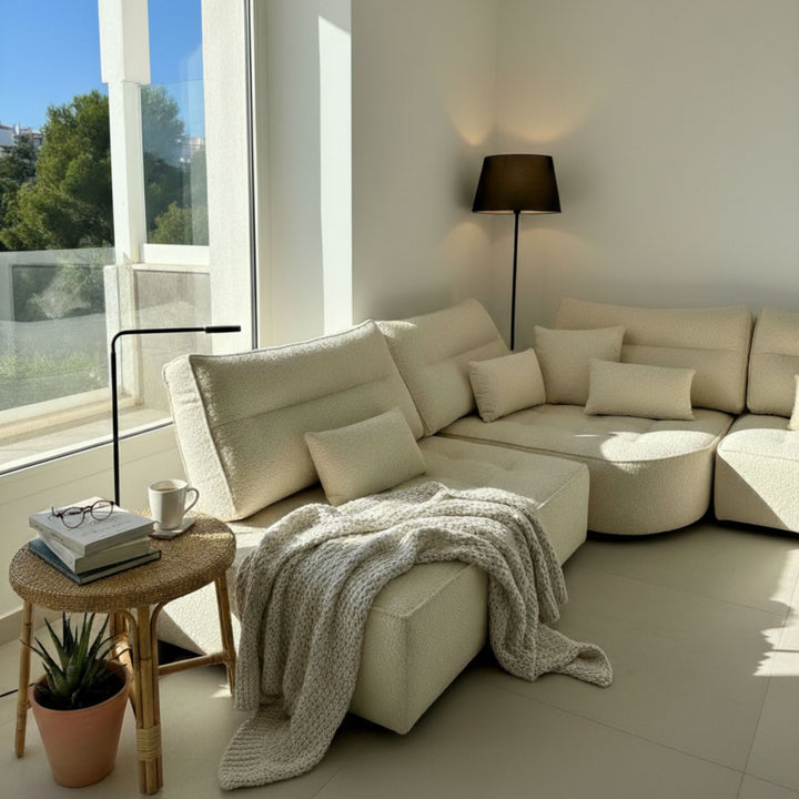 Cozy living room scene with the Hera Modular Sofa styled with throws and cushions.