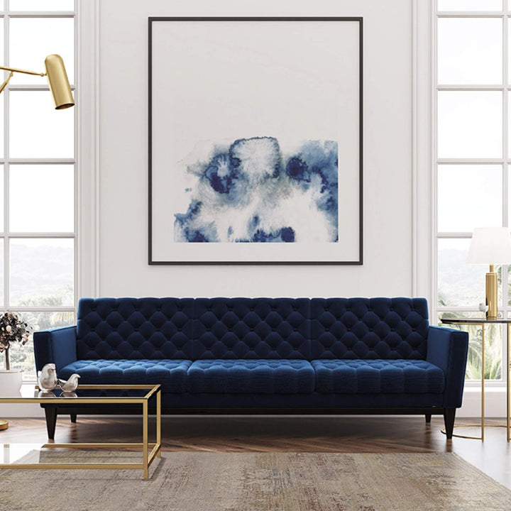 Living room setting with the Himalaya rug placed under a navy blue sofa.