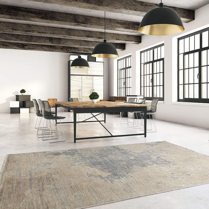 Living room interior featuring the Himalaya rug under a modern blue sofa.