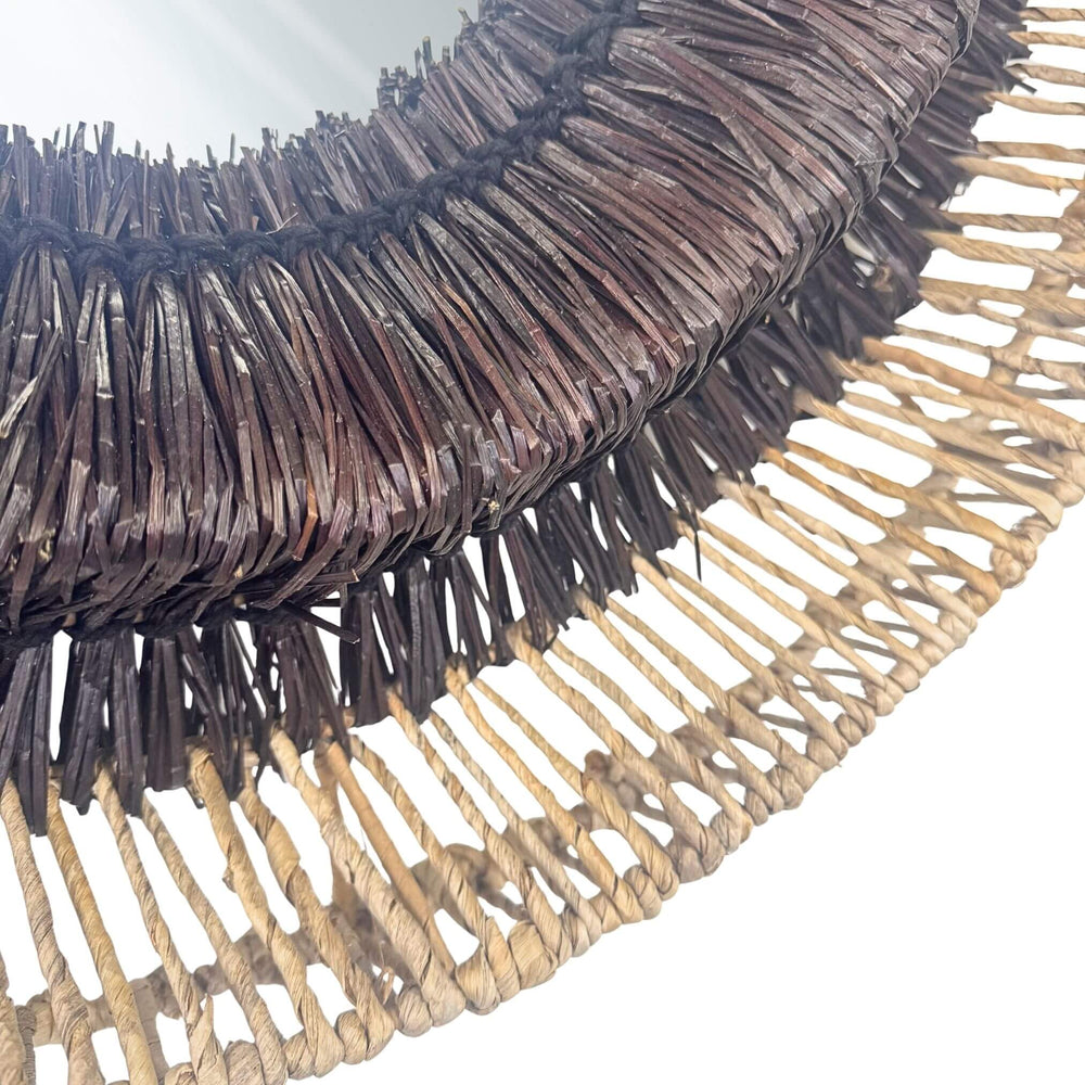 Close-up of layered rattan weave on Hitam Round Mirror frame