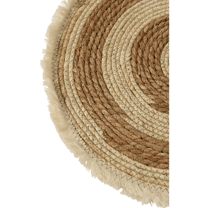 Close-up of woven rattan and fiber texture with fringe edge detail.

