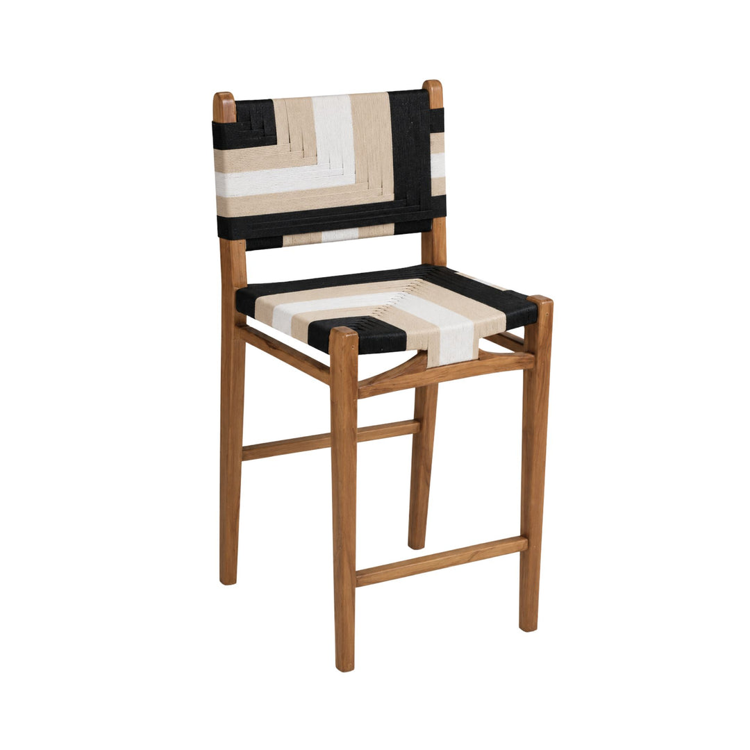 Front angled view of the Huraa kitchen stool with teak wood frame and geometric black and ivory rope weaving
