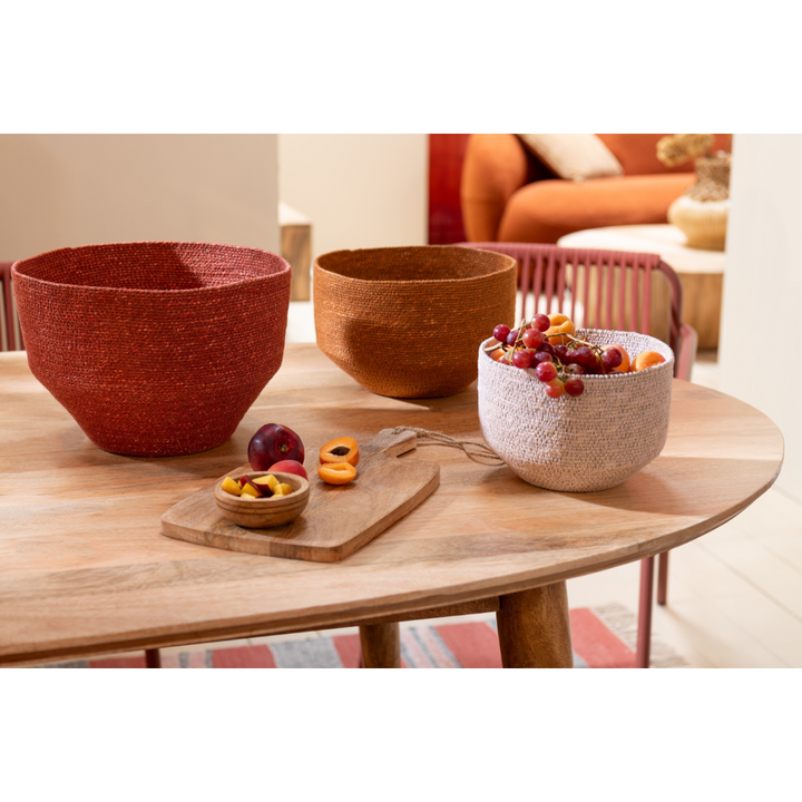 Trio of two-tone fiber baskets styled on a tabletop