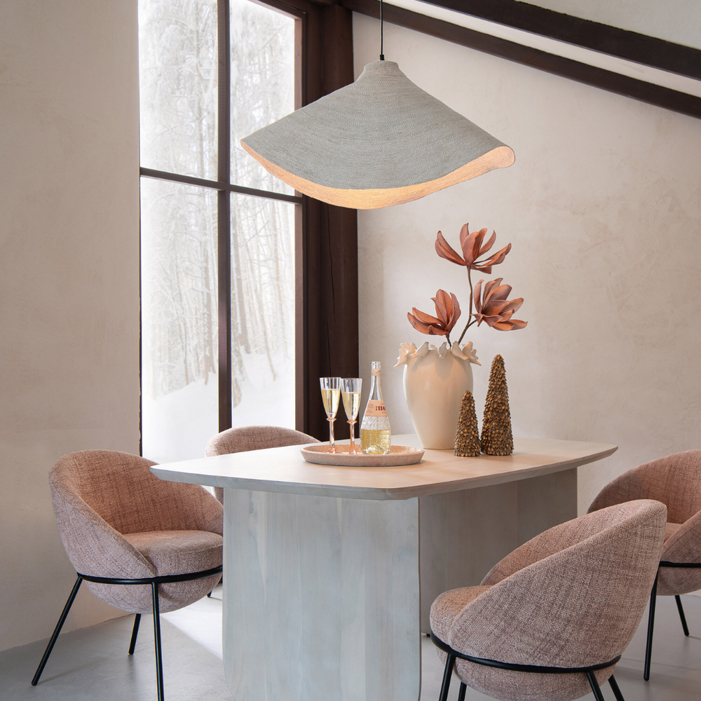 Beige/White Hurgada ceiling lamp hanging above a dining table with natural light.