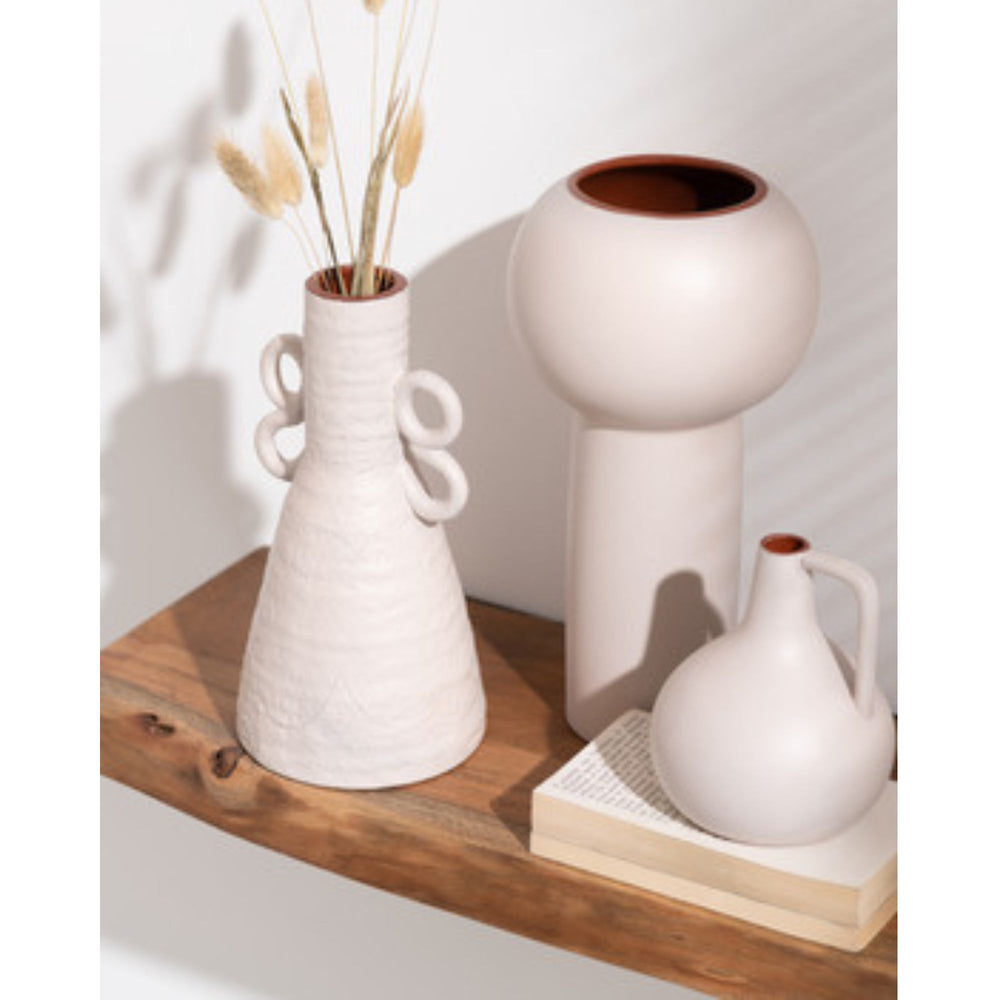 Styled interior scene showing the Imelda vase paired with other ceramic decor pieces.