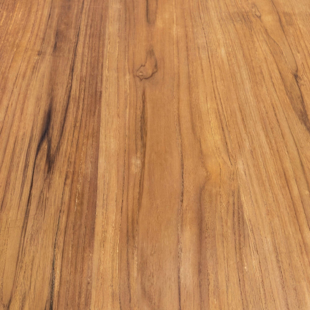 Top view of the teak wood surface showing the natural grain and warm tone variation.