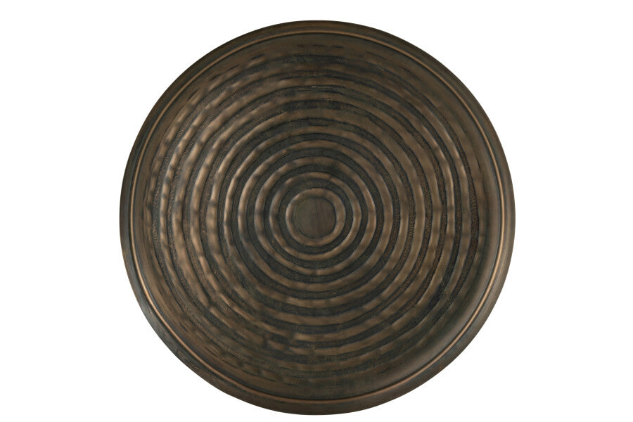 Front view of the round metal tray with concentric circular texture.