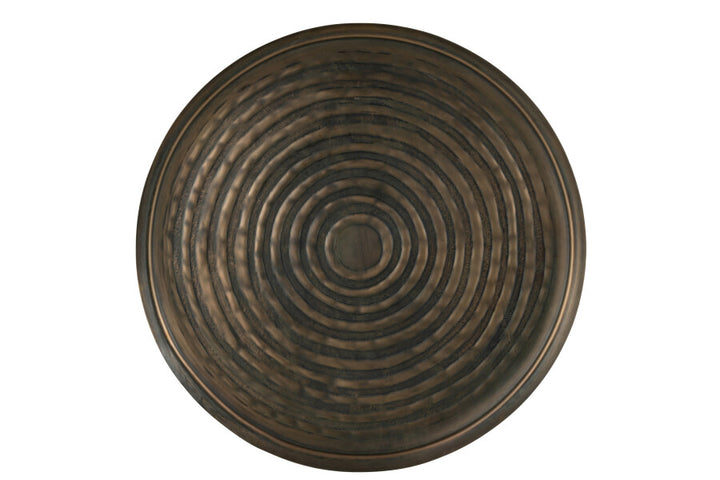 Front view of the round metal tray with concentric circular texture.