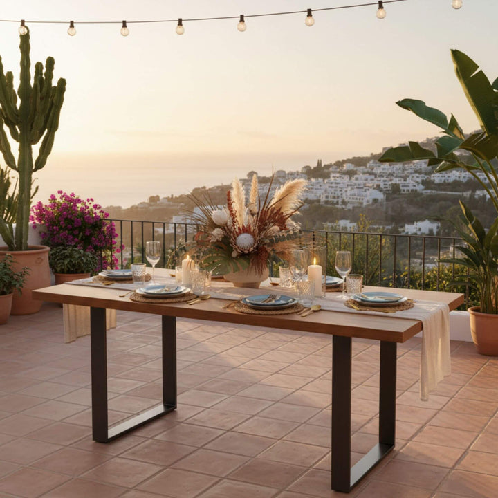 Outdoor terrace setting with the natural iroko wood dining table.