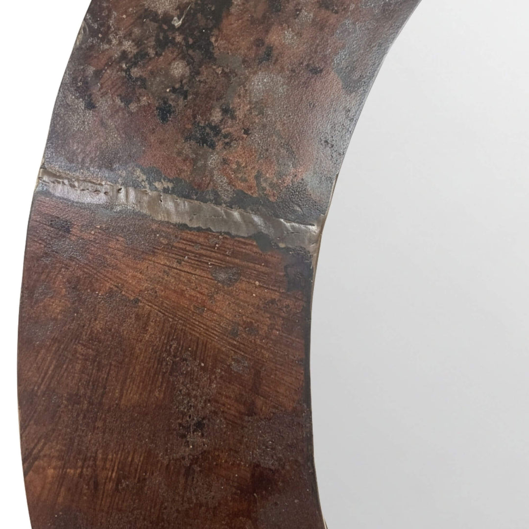 Close-up of the iron frame showing natural patina and texture of the Iron Round Mirror.