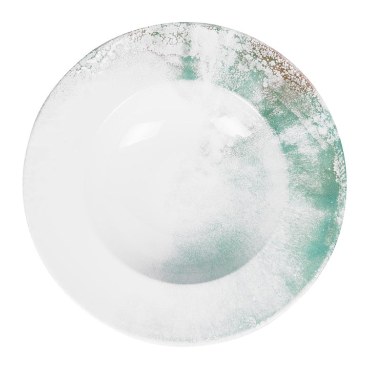 Top view of Islande ceramic pasta plate with white and green coastal-inspired glaze.
