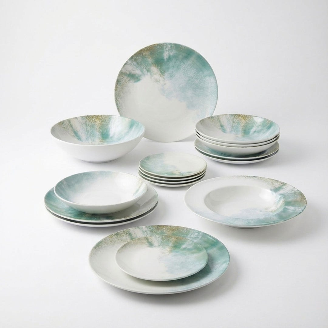 Group view of Islande ceramic tableware with white and green coastal-inspired glaze.