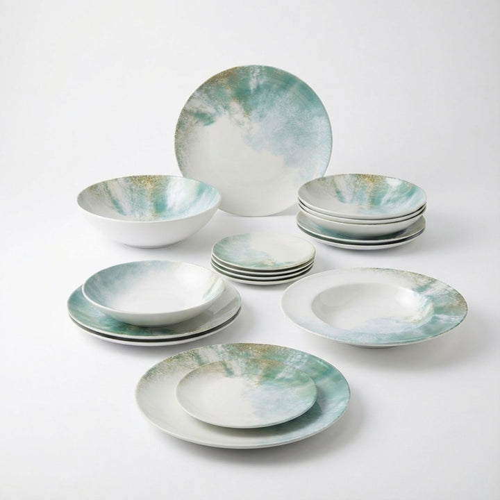 Group view of Islande ceramic tableware with white and green coastal-inspired glaze.