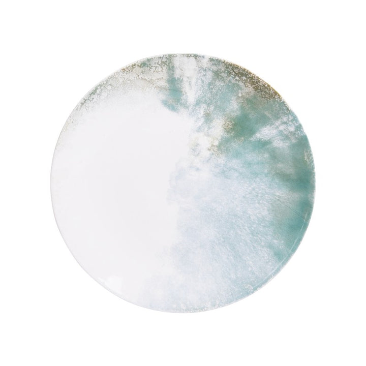Top view of Islande ceramic bowl with white and green coastal-inspired glaze.