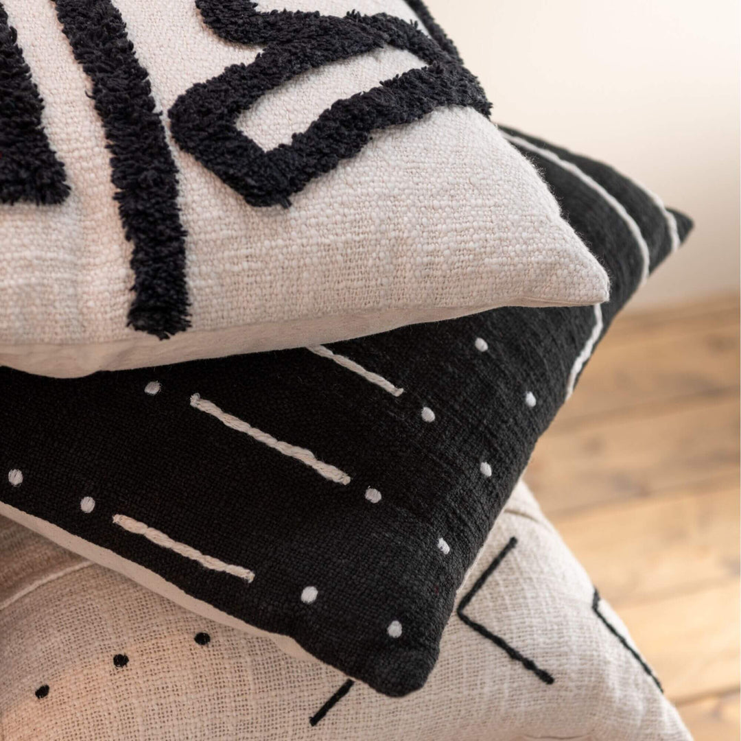 Close-up of the Jacob cushion showing detailed stitching and textured cotton fabric.