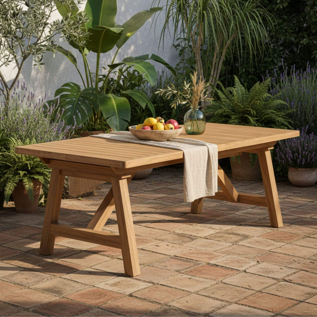 Outdoor garden setting featuring the Jaipur Acacia Extensible Dining Table in natural wood.