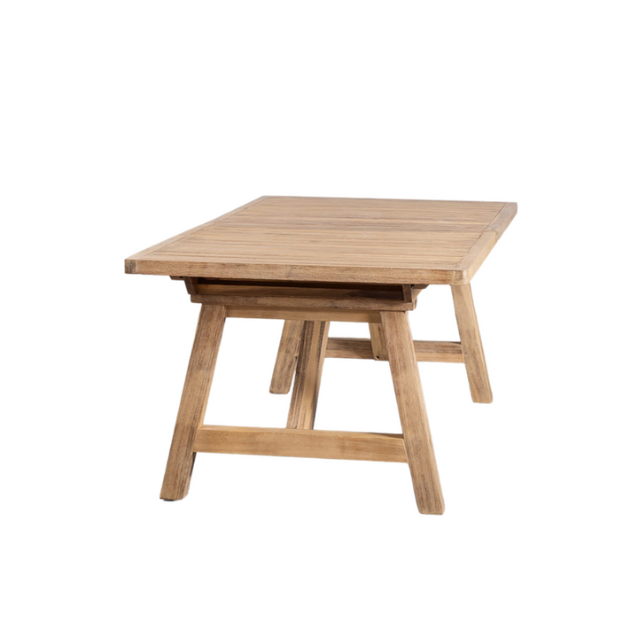 Side view highlighting the table’s acacia wood surface and extension system.