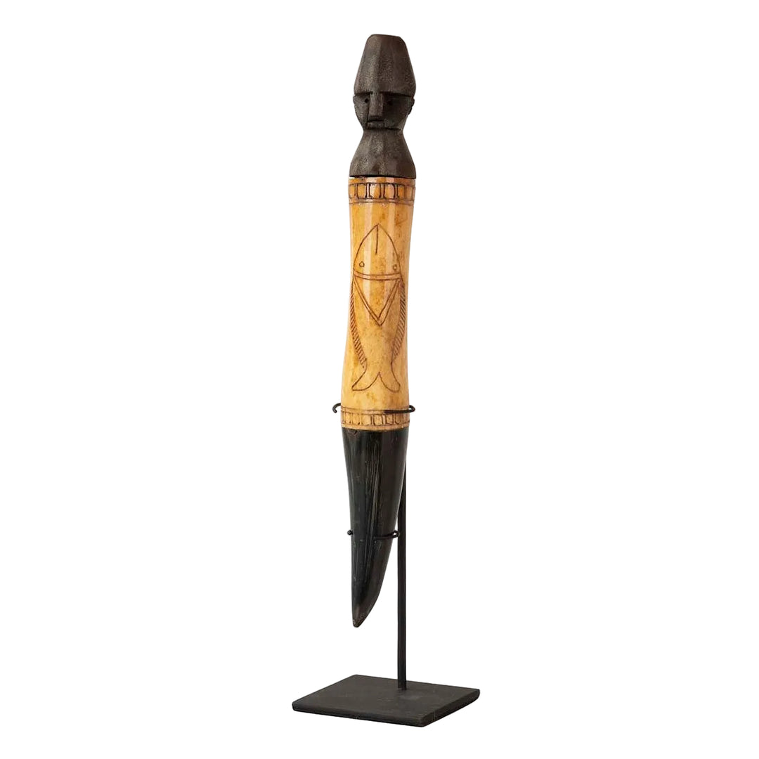 Tall decorative wooden stand figure with metal base and carved details on white background.