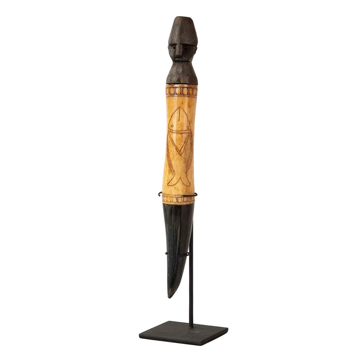 Tall decorative wooden stand figure with metal base and carved details on white background.