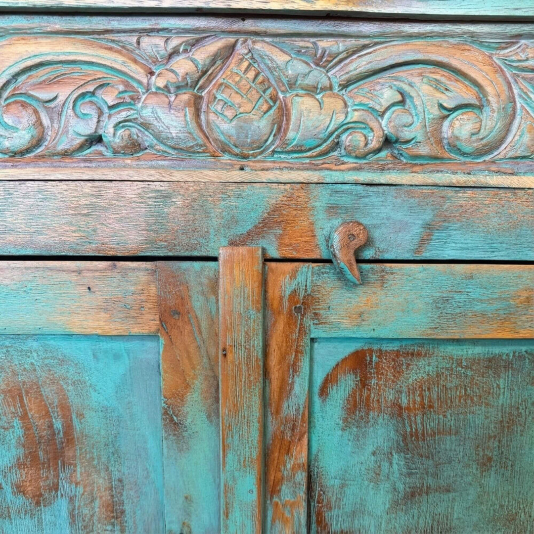 Close-up of carved details on the Jimbaran buffet doors.