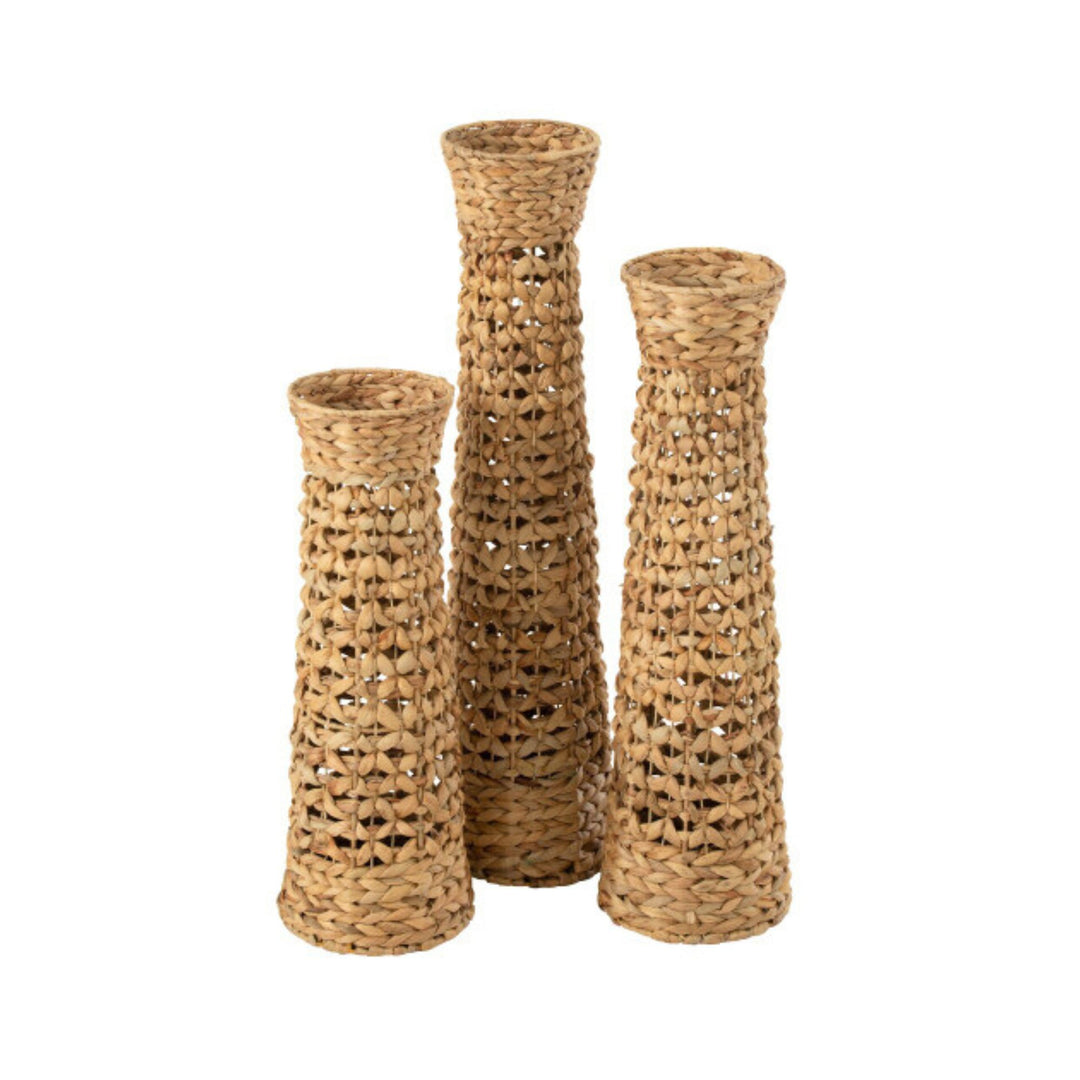 Group of Jonas woven vases in natural water hyacinth showcasing their tall, textured design.