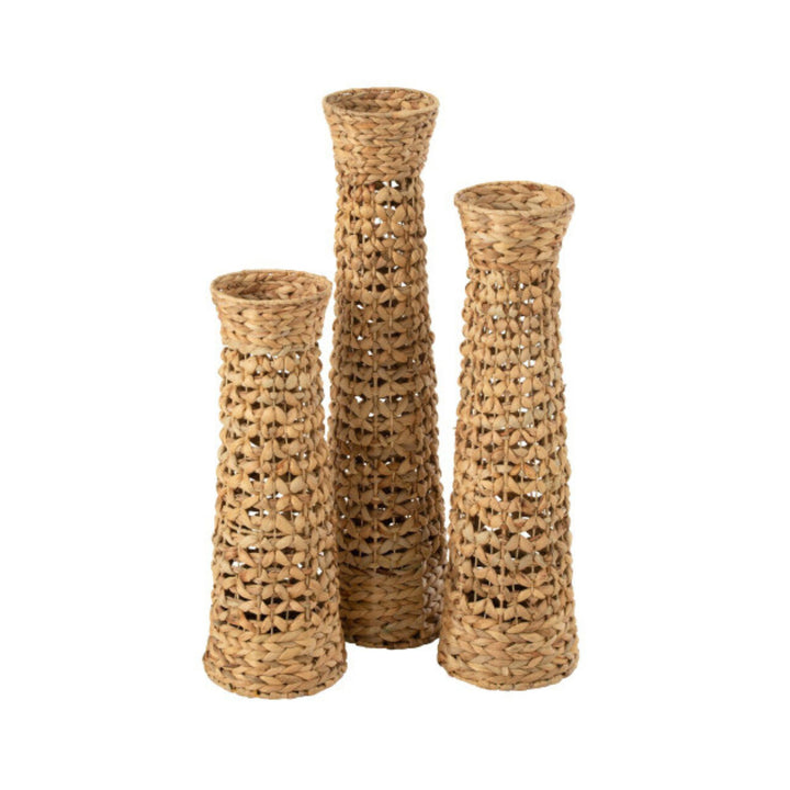 Group of Jonas woven vases in natural water hyacinth showcasing their tall, textured design.